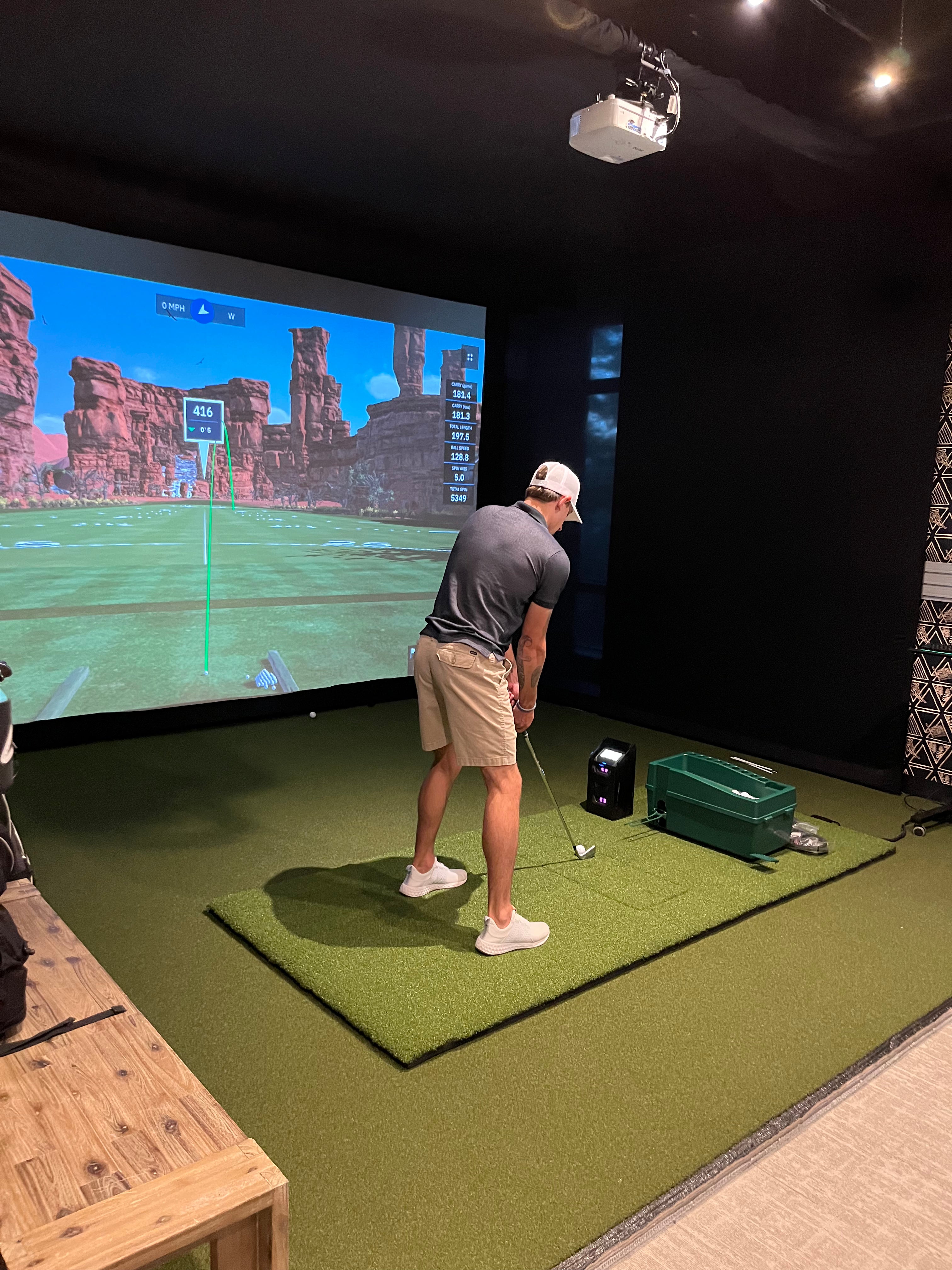 Golf on a large indoor golf simulator leased from Launch House Golf at Hotel Terra in Jackson Hole, Wyoming